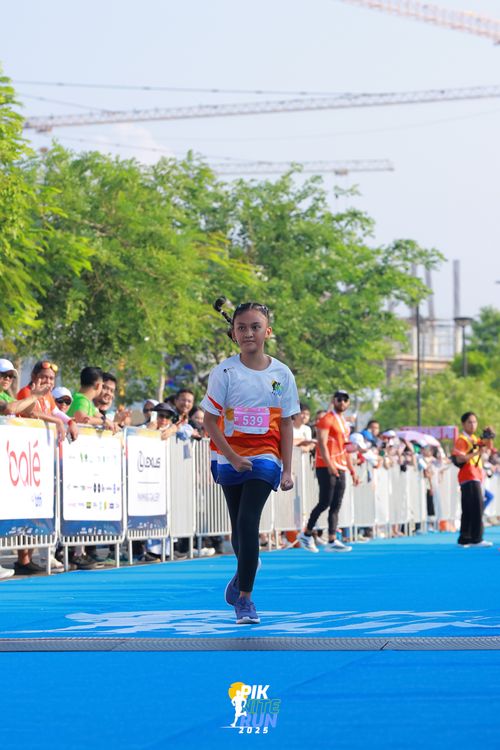 Race photo from PIK NITE RUN 2025