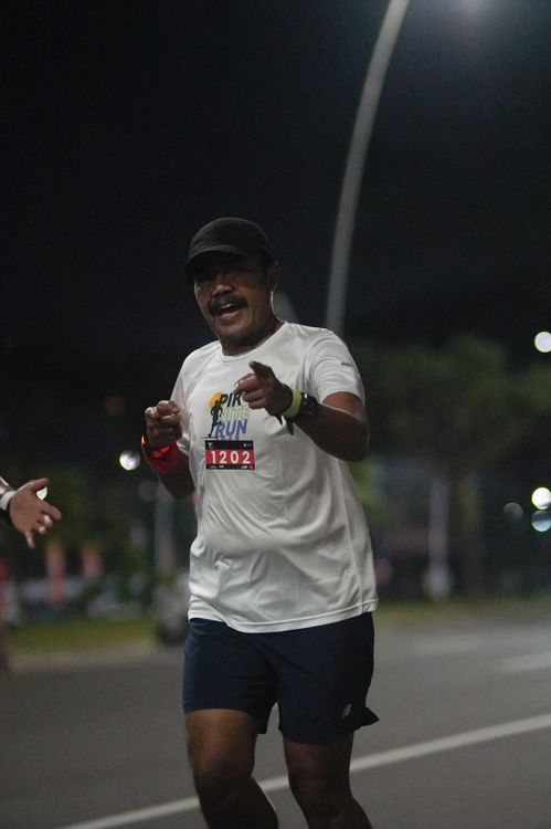 Race photo from PIK NITE RUN VIBES