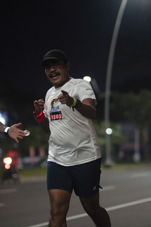 Race photo from PIK NITE RUN VIBES