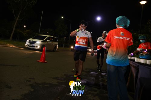 Race photo from PIK NITE RUN 2025