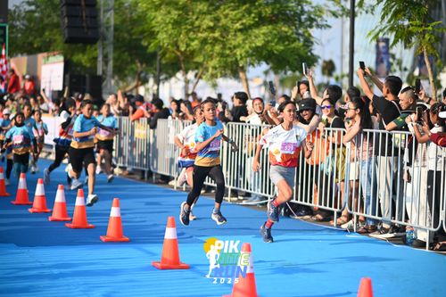 Race photo from PIK NITE RUN 2025
