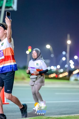 Race photo from PIK NITE RUN 2025