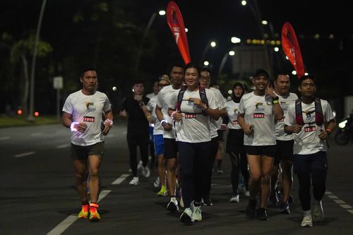Race photo from PIK NITE RUN VIBES