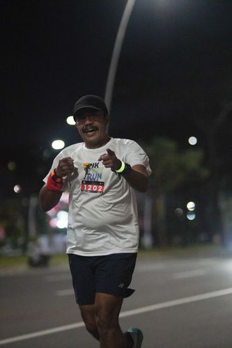 Race photo from PIK NITE RUN VIBES