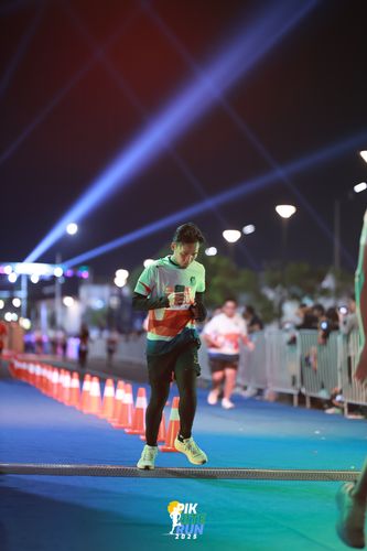 Race photo from PIK NITE RUN 2025