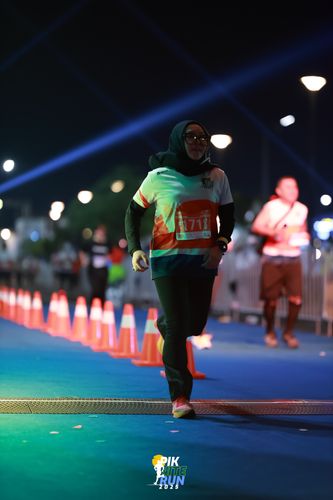 Race photo from PIK NITE RUN 2025