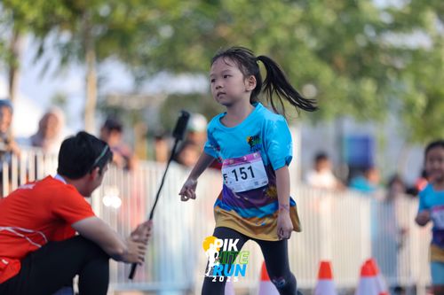 Race photo from PIK NITE RUN 2025