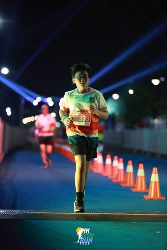 Race photo from PIK NITE RUN 2025