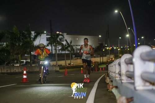 Race photo from PIK NITE RUN 2025
