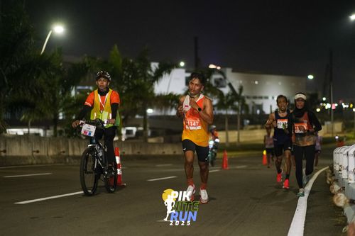 Race photo from PIK NITE RUN 2025