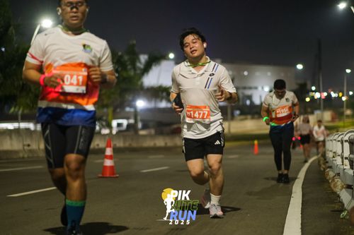 Race photo from PIK NITE RUN 2025