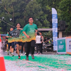 Race photo from BAUR RUN 2025