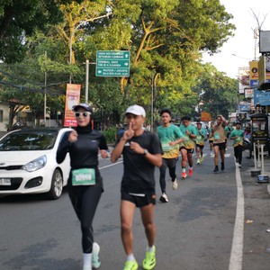 Race photo from BAUR RUN 2025